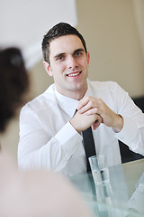 Image showing young business man alone in conference room