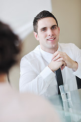 Image showing young business man alone in conference room