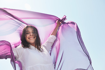 Image showing beautiful young woman on beach with scarf