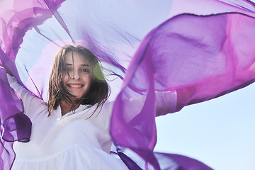 Image showing beautiful young woman on beach with scarf