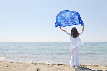 Image showing beautiful young woman on beach with scarf