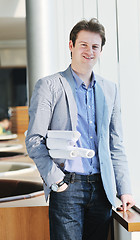 Image showing young business man alone in conference room