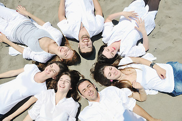 Image showing Group of happy young people in have fun at beach