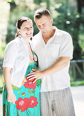 Image showing Happy pregnant couple at beautiful sunny day in park