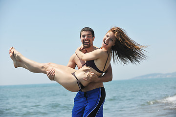 Image showing happy young couple have fun on beach