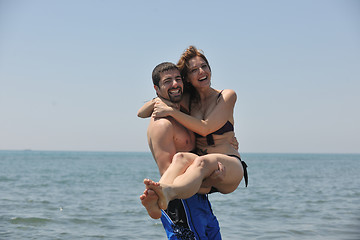 Image showing happy young couple have fun on beach