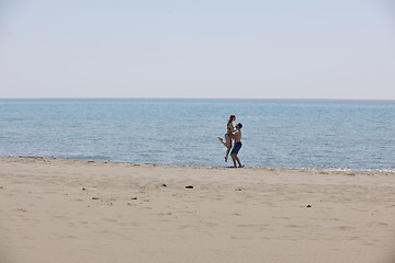 Image showing happy young couple have fun on beach