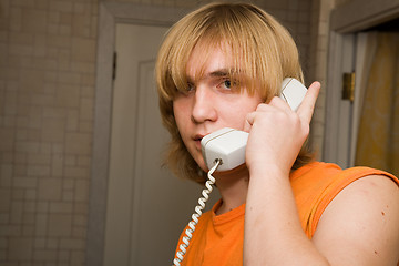 Image showing Young man speaking by phone.