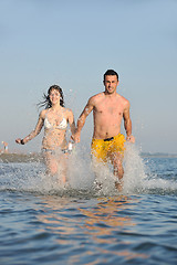 Image showing happy young couple have fun on beach