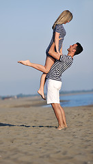 Image showing happy young couple have fun on beach