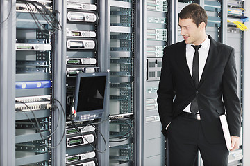 Image showing young it engeneer in datacenter server room