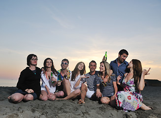 Image showing Group of young people enjoy summer  party at the beach