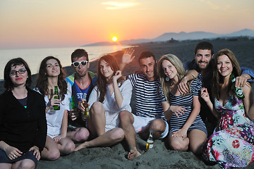 Image showing Group of young people enjoy summer  party at the beach