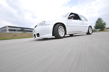 Image showing Fast car moving with motion blur