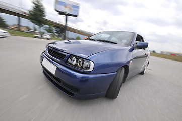 Image showing Fast car moving with motion blur