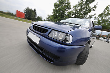 Image showing Fast car moving with motion blur