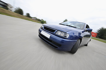 Image showing Fast car moving with motion blur