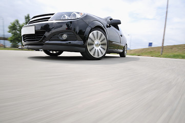 Image showing Fast car moving with motion blur