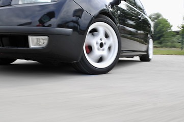 Image showing Fast car moving with motion blur