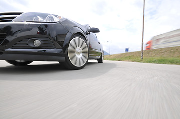 Image showing Fast car moving with motion blur