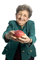 Image showing senior woman with mango