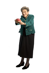 Image showing senior woman with mango