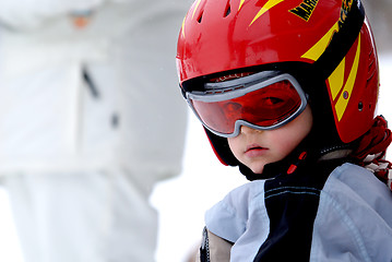 Image showing Little skier with helmet and goggles