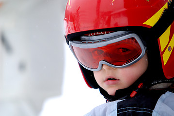 Image showing Little skier with helmet and goggles