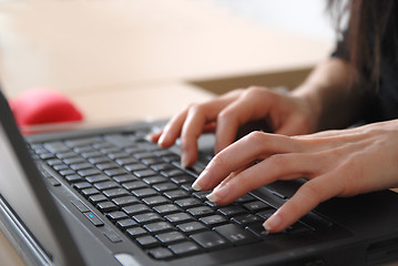 Image showing woman hands typing on laptop keyboard