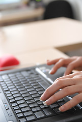 Image showing woman hands typing on laptop keyboard