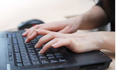 Image showing woman hands typing on laptop keyboard