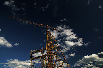 Image showing crane with dramatic clouds  in background