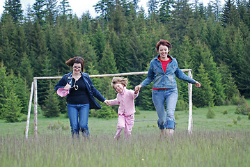 Image showing happy girls running in nature