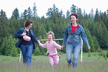 Image showing happy girls running in nature