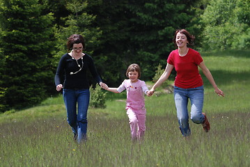 Image showing happy girls running in nature