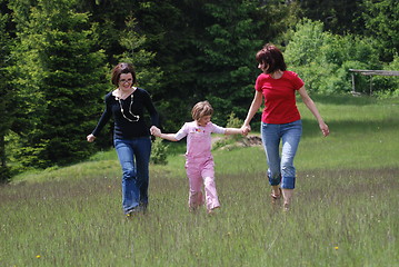 Image showing happy girls running in nature