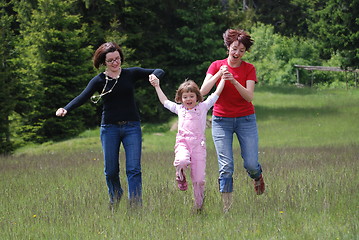 Image showing happy girls running in nature