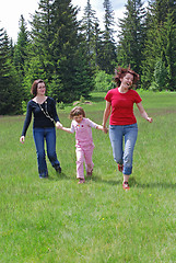 Image showing happy girls running in nature