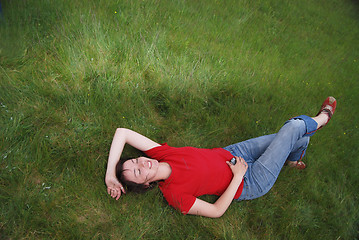 Image showing woman laying in grass