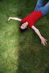 Image showing woman laying in grass