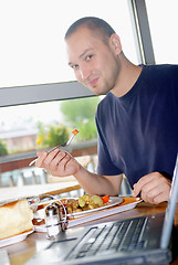 Image showing man eating healthy food it an restaurant