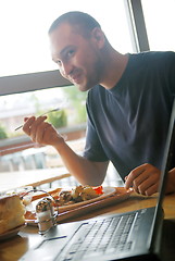 Image showing man eating healthy food it an restaurant