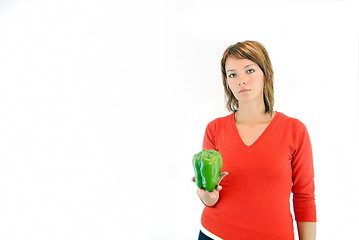 Image showing pretty girl with pepper isolated