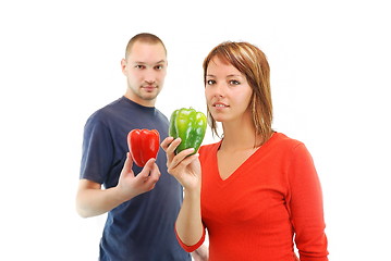 Image showing happy couple with peppers isolated