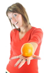 Image showing happy girl with orange in hand