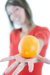 Image showing happy girl with orange in hand