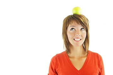 Image showing pretty girl with apple on head