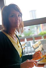 Image showing woman eating at an restaurant