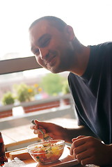 Image showing man eating healthy food it an restaurant