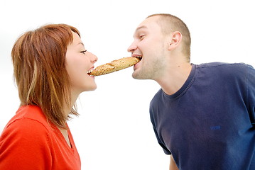 Image showing happy couple eating croissant